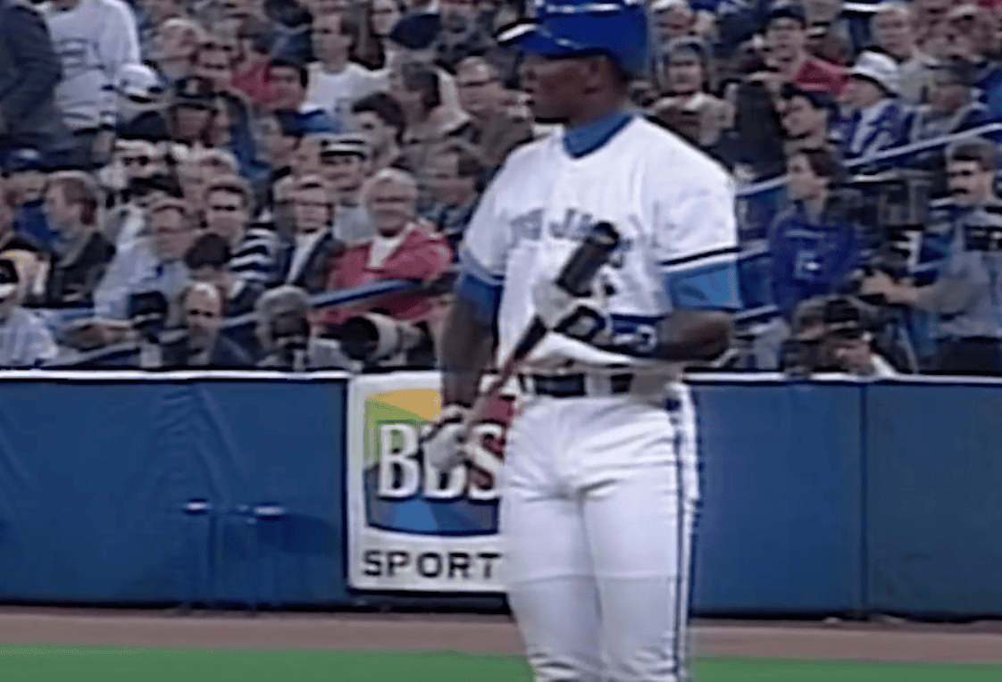 Carlos Delgado in action, showcasing his power hitting for the Blue Jays.